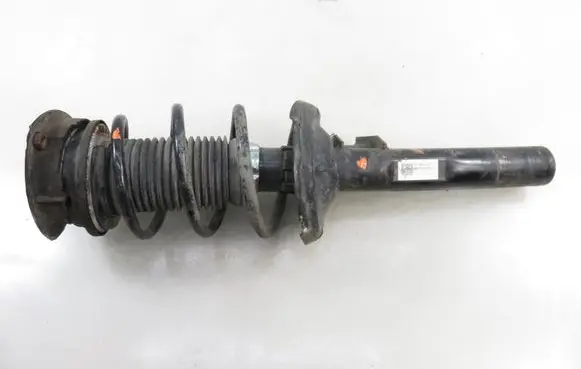 Volkswagen Golf VII Front shock absorber with coil spring 5Q0413023GQ