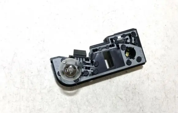 Nissan Primera Tail light bulb cover holder