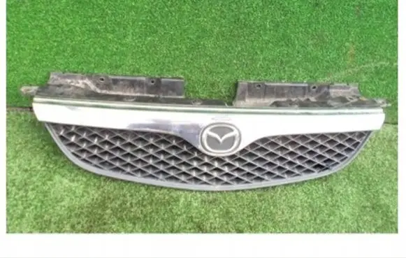Mazda 626 Front bumper upper radiator grill