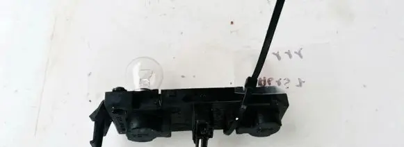 Tail light bulb cover holder