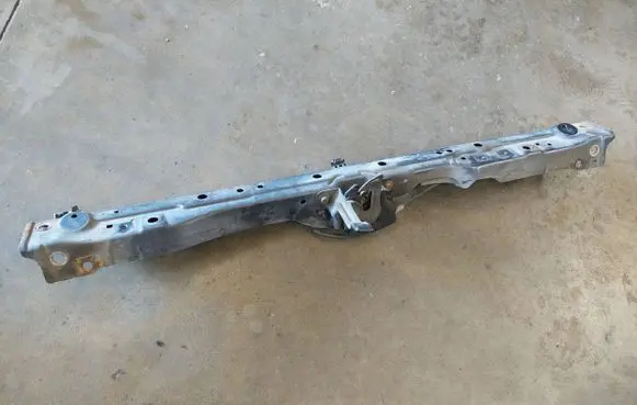 Top upper radiator support slam panel