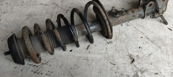 Suzuki Swift I Front shock absorber with coil spring 4160162J32