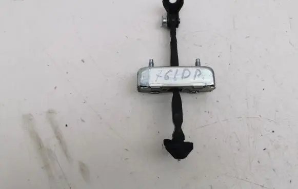 Front door check strap stopper
