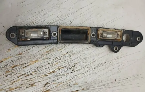 Volkswagen Touran I Trunk door license plate light bar 1T0827574C