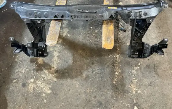 Top upper radiator support slam panel
