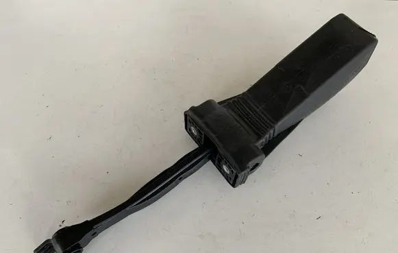 Front door check strap stopper
