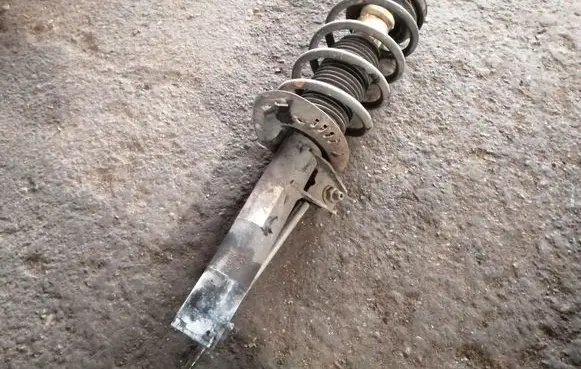 Volkswagen PASSAT B7 Front shock absorber with coil spring