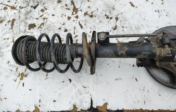 Peugeot 208 I Front shock absorber with coil spring 