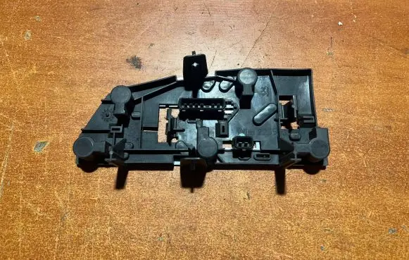 Tail light bulb cover holder