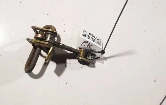 Front door check strap stopper