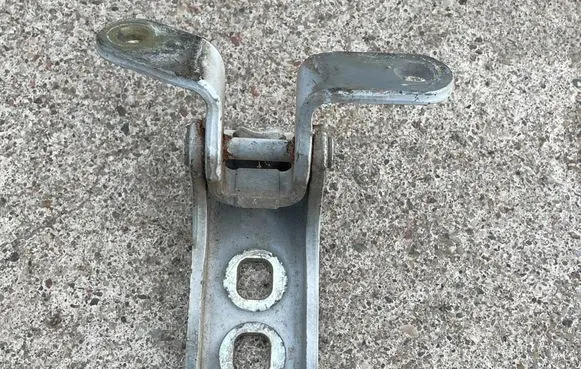 Front door lower hinge
