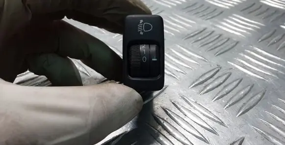 Headlight level height control switch