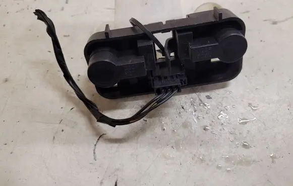 Tail light bulb cover holder