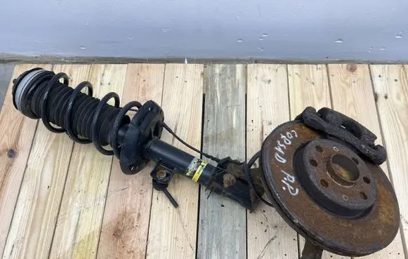Opel Corsa D Front shock absorber with coil spring 