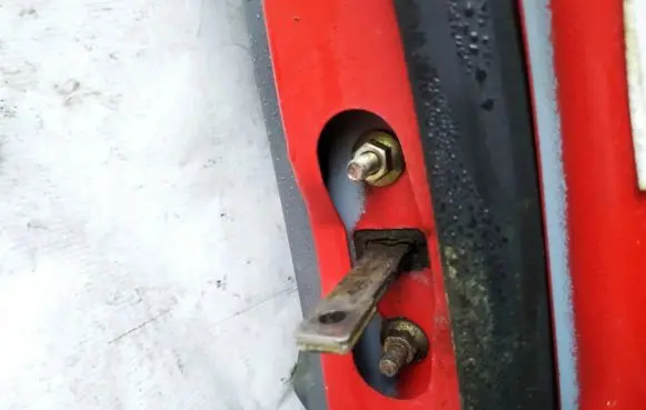 Mazda 121 Front door check strap stopper 