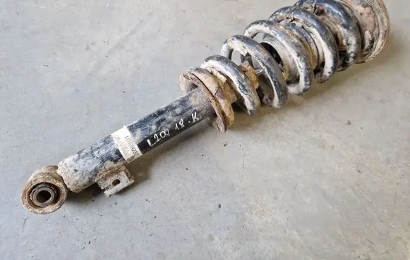 Mitsubishi L200 Front shock absorber with coil spring MR992321
