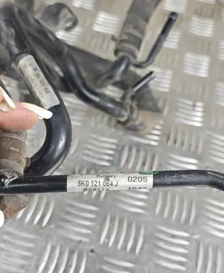 Volkswagen Touran III Engine coolant pipe/hose 04L121064AE