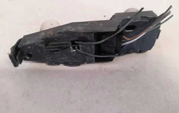 Tail light bulb cover holder