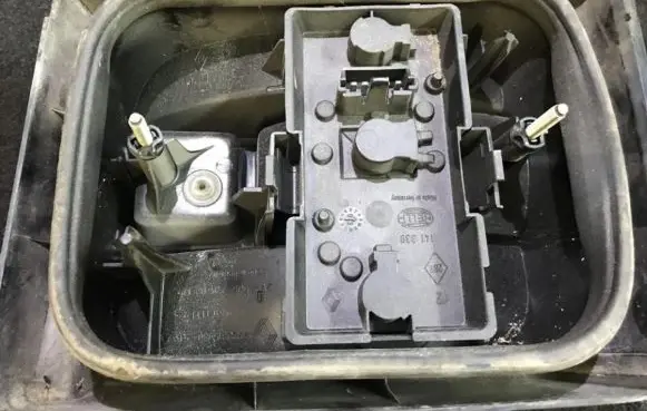 Tail light bulb cover holder