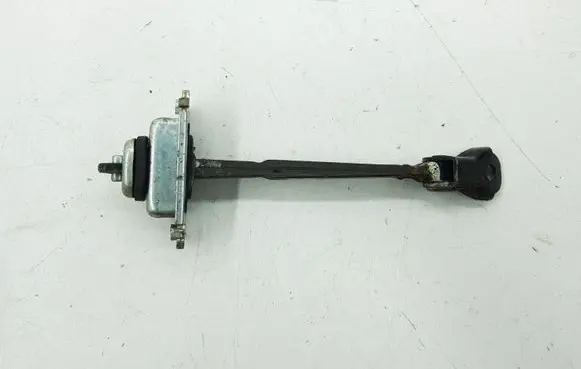 Front door check strap stopper