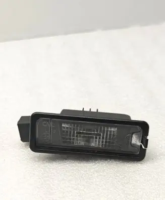 Volkswagen PASSAT CC Number plate light 1K8943021