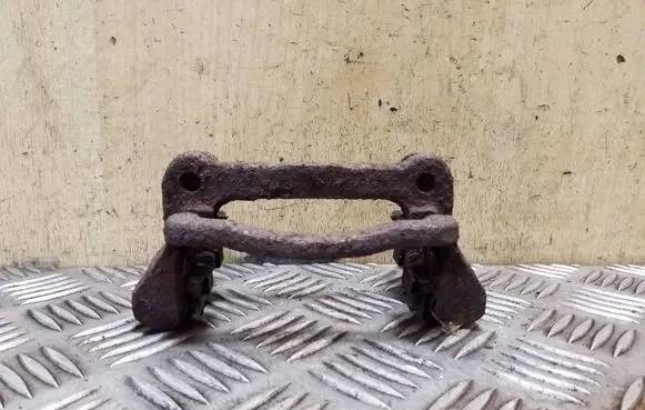 Toyota Corolla E120 E130 Brake caliper pad carrier rear 
