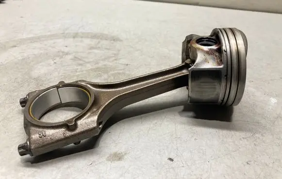 Piston with connecting rod