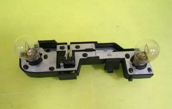 Tail light bulb cover holder