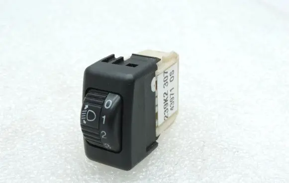 Headlight level height control switch