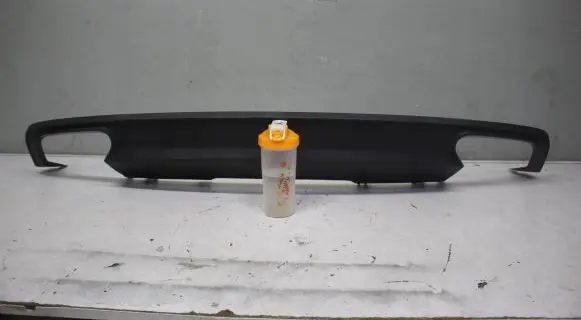 Rear bumper trim bar molding