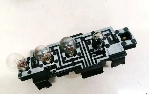 Tail light bulb cover holder