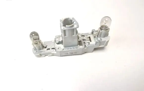 Tail light bulb cover holder