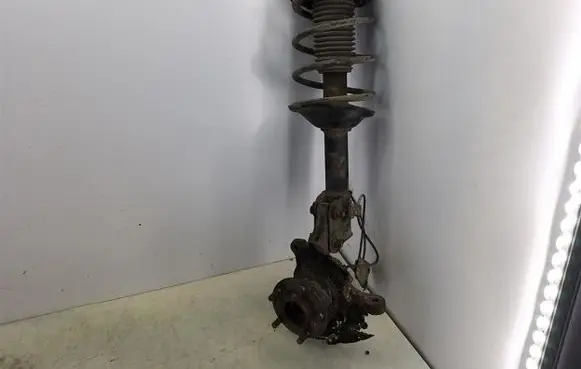 Subaru Forester SF Front shock absorber with coil spring