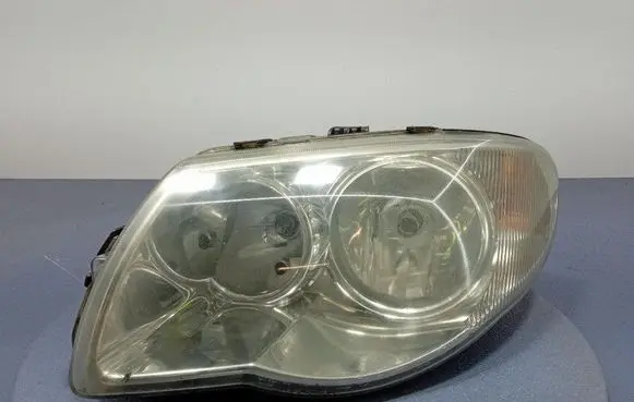 Chrysler Grand Voyager IV Headlight/headlamp 04857831AB