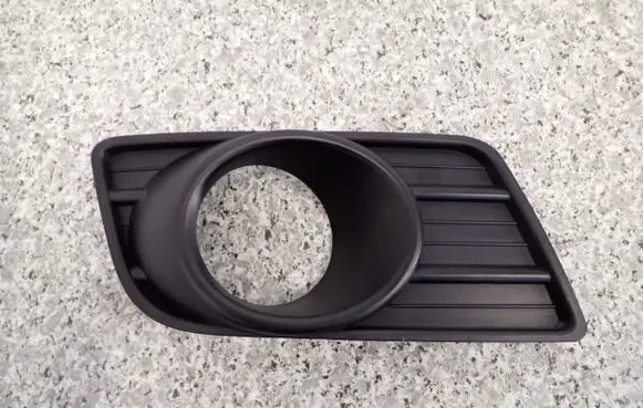 Suzuki Swift I Front fog light trim/grill