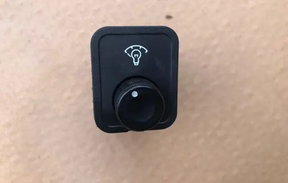 Panel lighting control switch