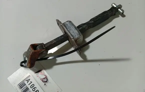 Front door check strap stopper
