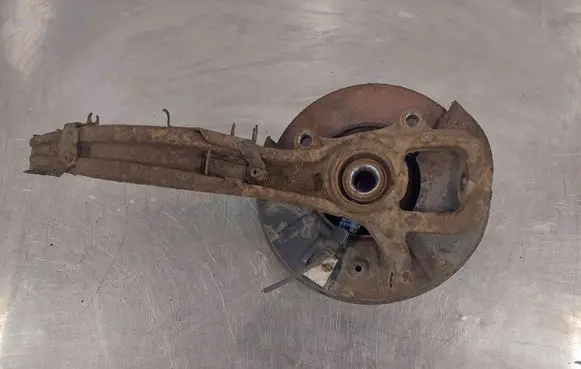 Volkswagen Touareg I Front wheel hub spindle knuckle 7L6407257A