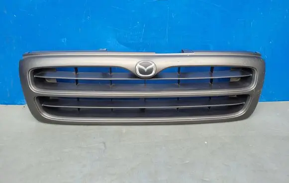 Mazda B series UF Front bumper upper radiator grill U00950710