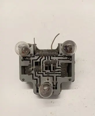 Tail light bulb cover holder