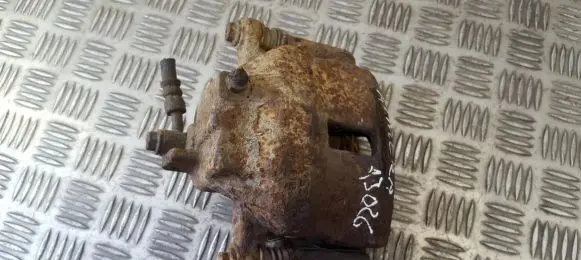 Nissan Almera N16 Front brake caliper