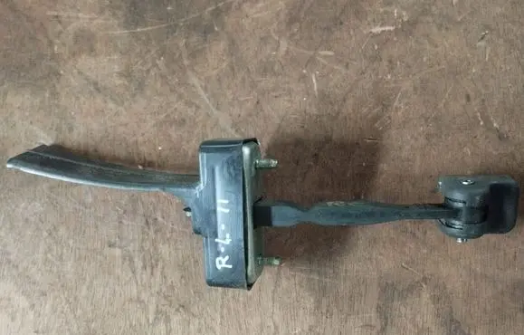 Rear door check strap stopper