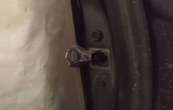 Front door check strap stopper