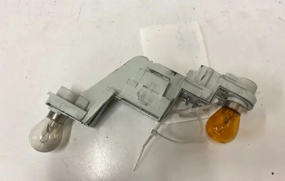 Volvo V50 Tail light bulb cover holder