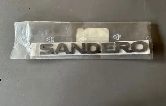 Dacia Sandero III Rear door emblem/model letters 908909679R