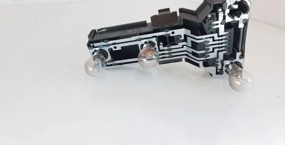 Tail light bulb cover holder