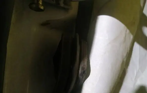 Front door check strap stopper