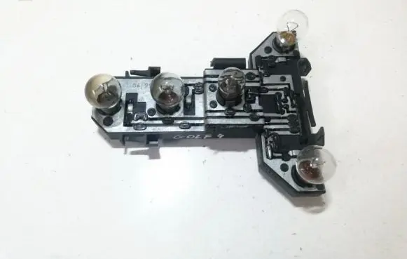 Tail light bulb cover holder