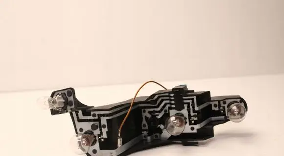 Tail light bulb cover holder