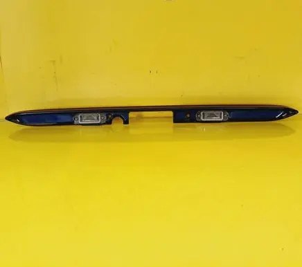 Trunk door license plate light bar